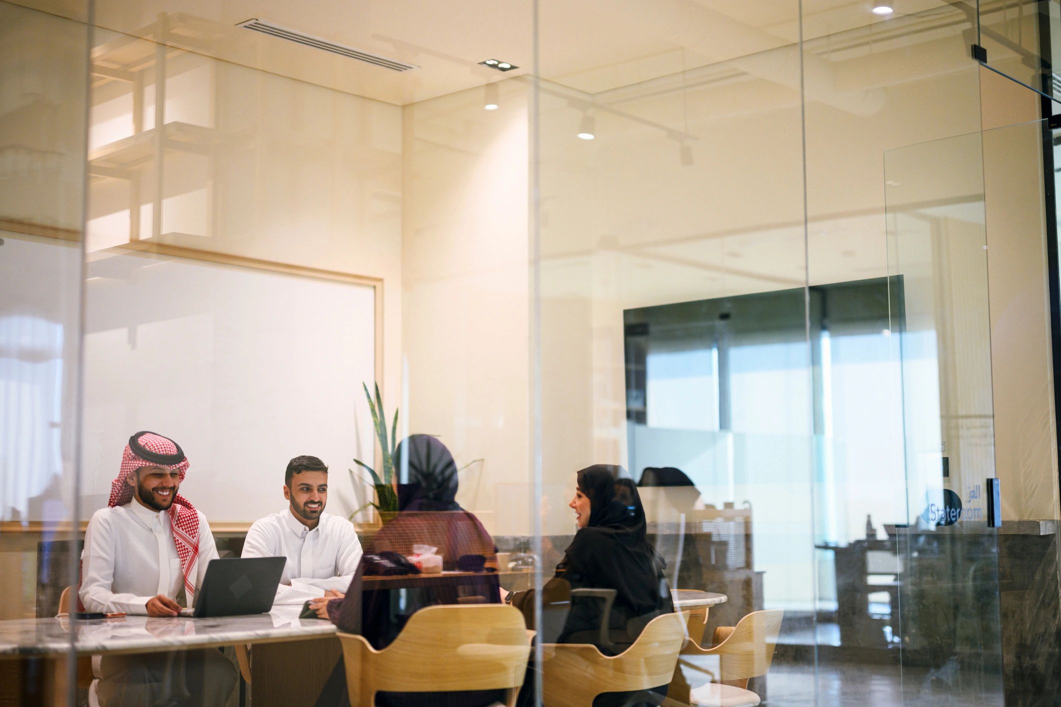 Arab business professionals meeting in a modern conference room
